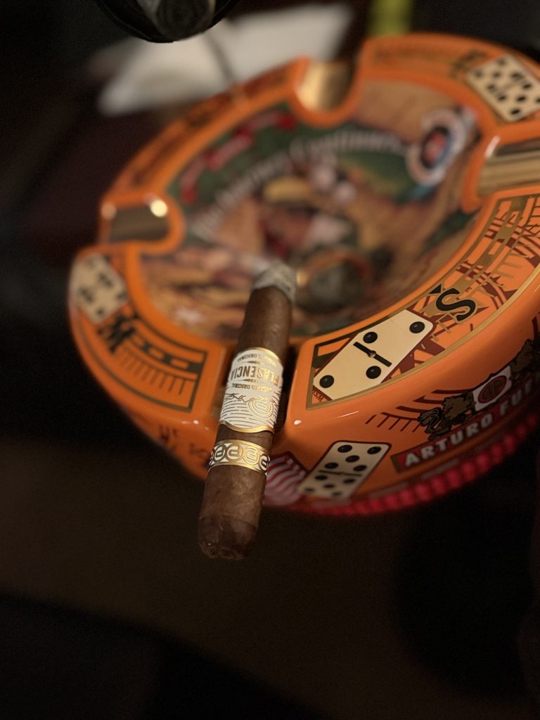 Close-up of the Plasencia Reserva Original Toro resting across an Arturo Fuente ashtray with the primary band prominently displayed during the second half of the smoke.