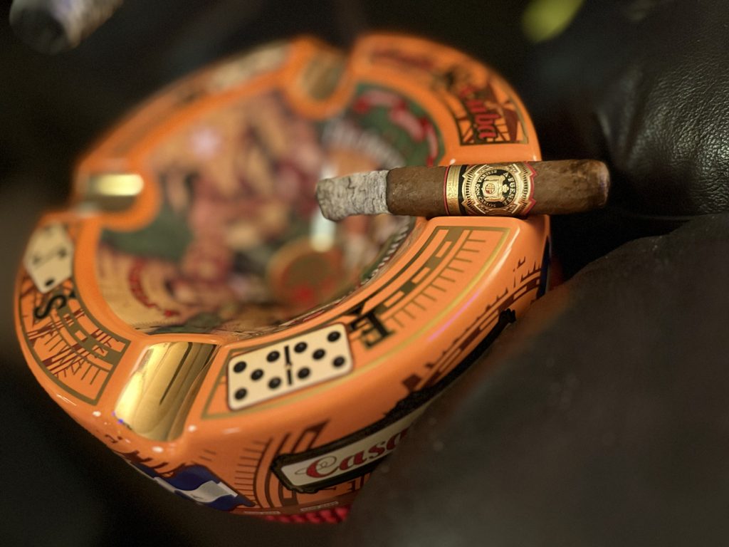 Arturo Fuente Reserva Don Carlos Robusto resting across a Casa Cuba ashtray during the first half of the smoke.