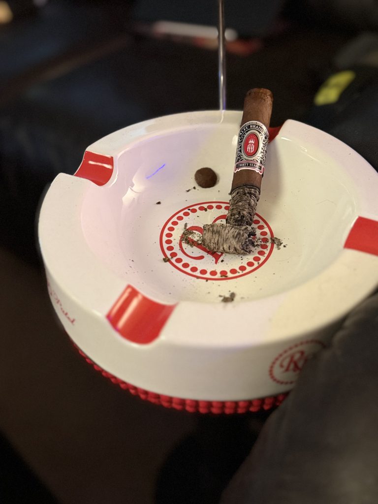 The Alec Bradley Thirty Year Toro stands upright in a Rocky Patel ashtray during the final third with a long, sturdy ash still intact.