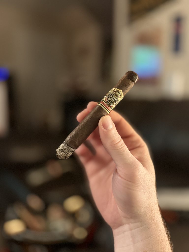 Lit Ashton VSG Sorcerer held in hand with ash developing at the foot.