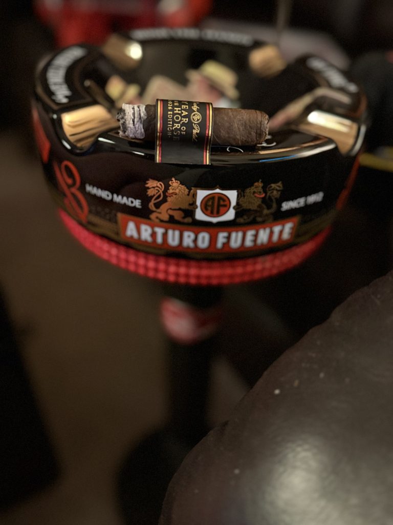 Rocky Patel Year of the Horse Churchill burning on an Arturo Fuente ashtray