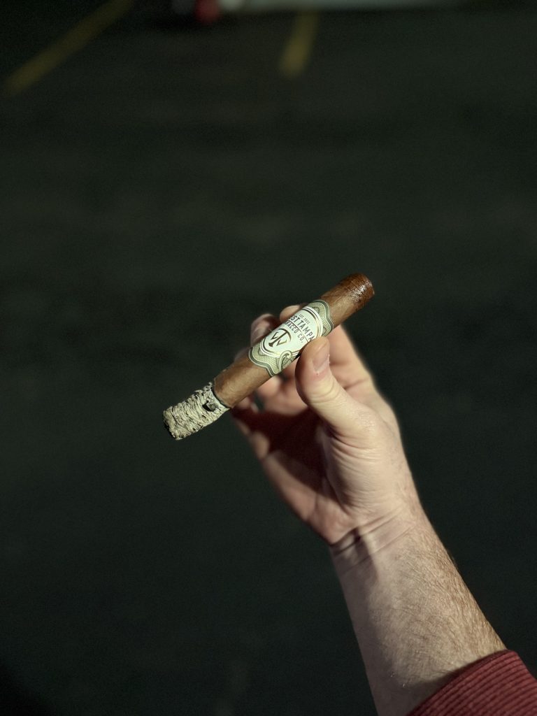 Close view of the West Tampa White Toro Ecuadorian Habano wrapper and cigar bands.