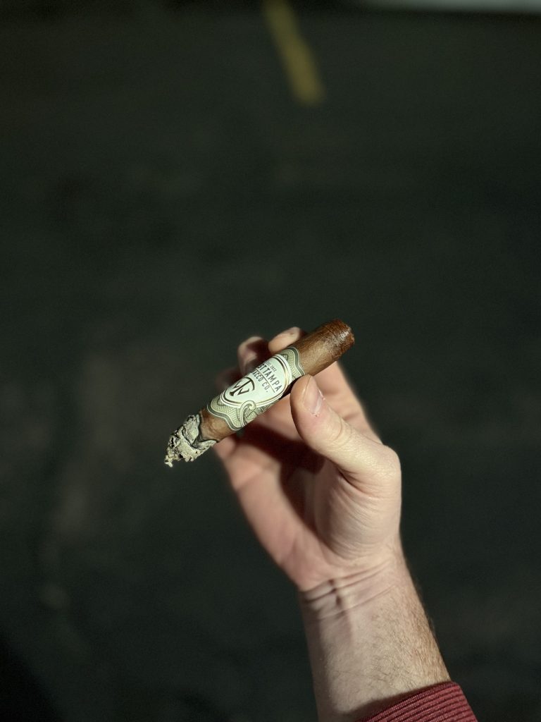 West Tampa White Toro burning outdoors with ash developing during the review.