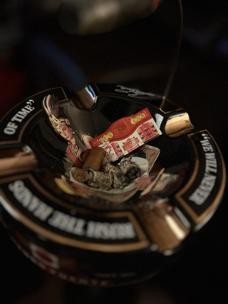 Finished Romeo y Julieta 1875 Miami Deco Toro band and cigar remnants inside an ashtray.