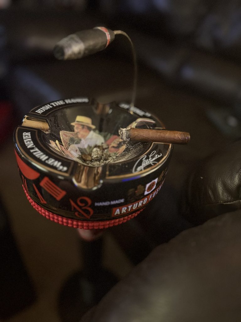 Diamond Crown Julius Caeser Toro burning in an Arturo Fuente ashtray during the review.