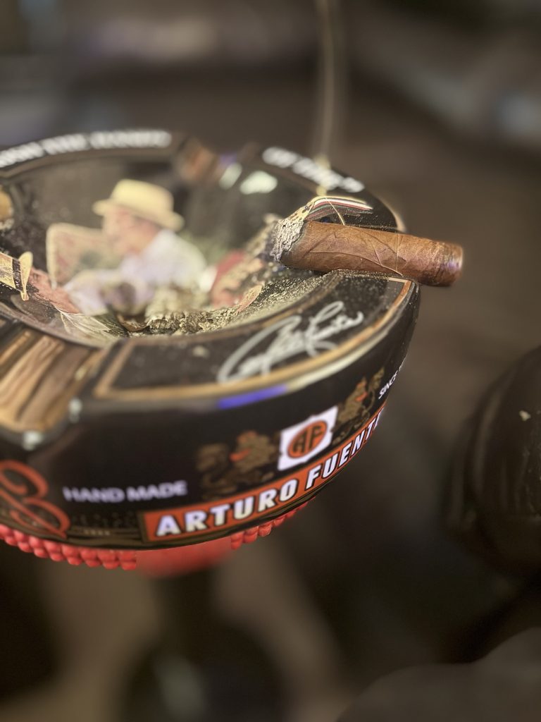 Close-up of the Diamond Crown Julius Caeser Toro showing its wrapper and ash during the review.
