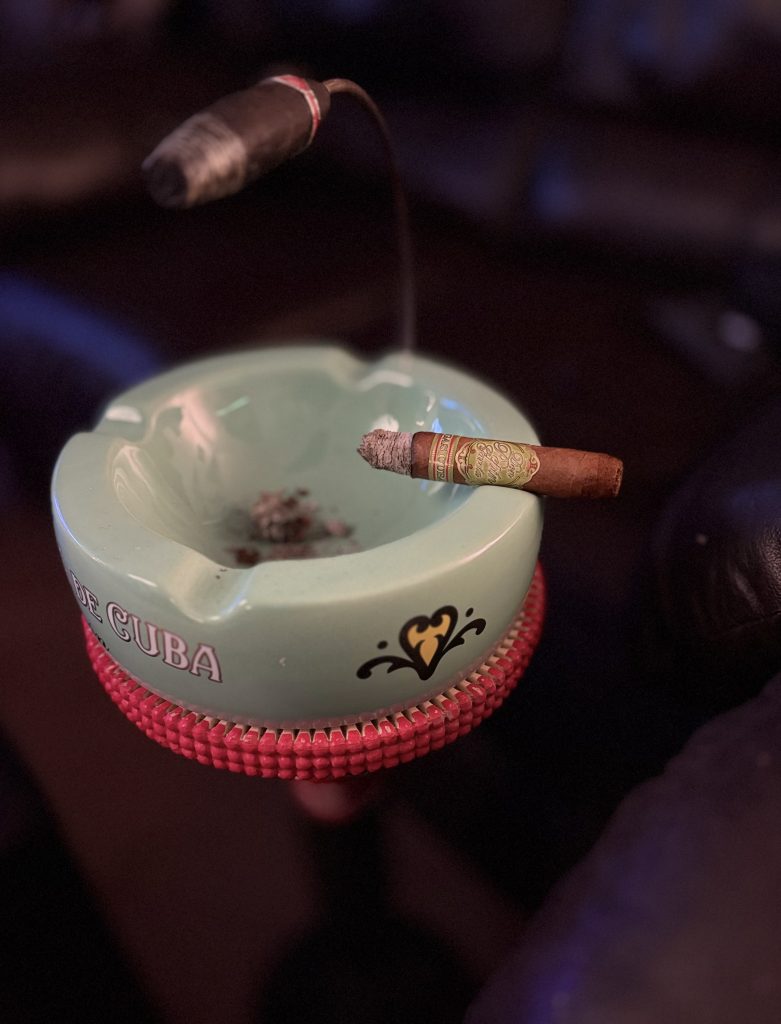 Don Pepin Garcia Vegas Cubanas Toro burning across a green My Father ashtray with its lime-green bands visible.