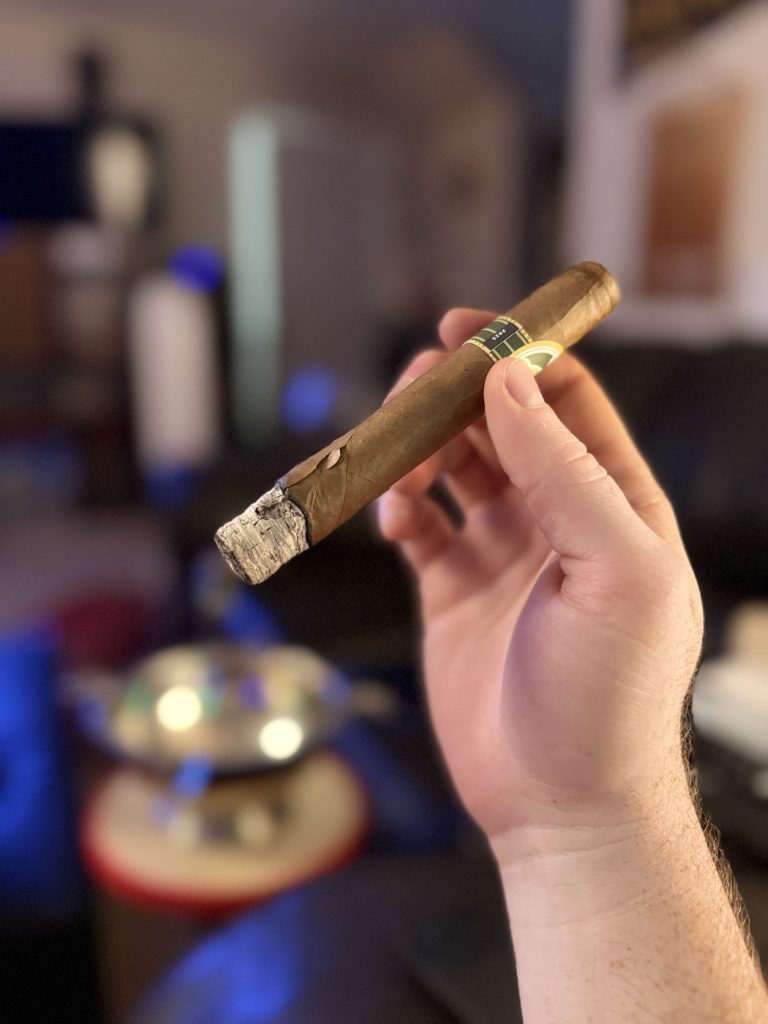 Lure Tally Allie Habano Toro showing a visible wrapper crack near the ash and burn line.