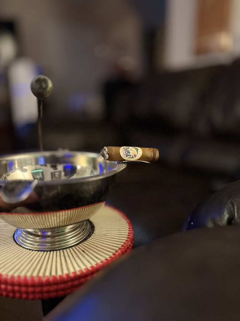 Lure Cigars Tally Allie Habano Toro resting on a metal ashtray during the final portion of the cigar.