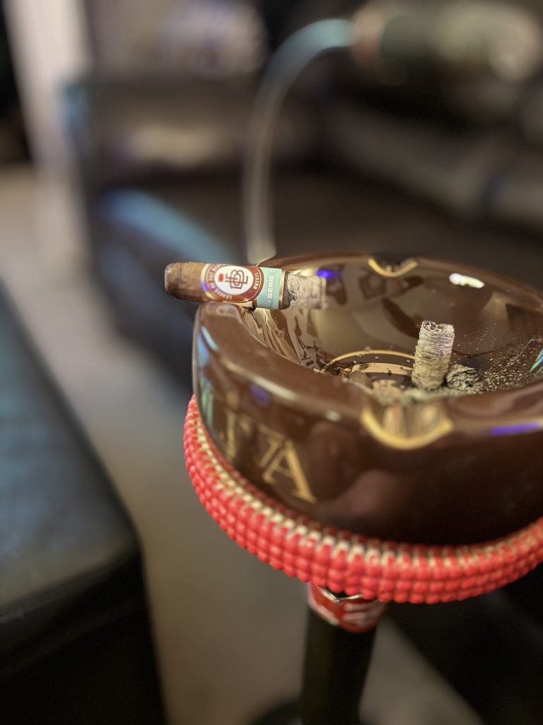 League of Fat Bastards Serie O Toro burning into the final third while resting on a brown Oliva ashtray.