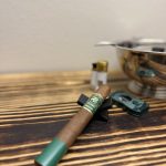 OZ Family Maracana Toro resting on a black cigar stand before lighting