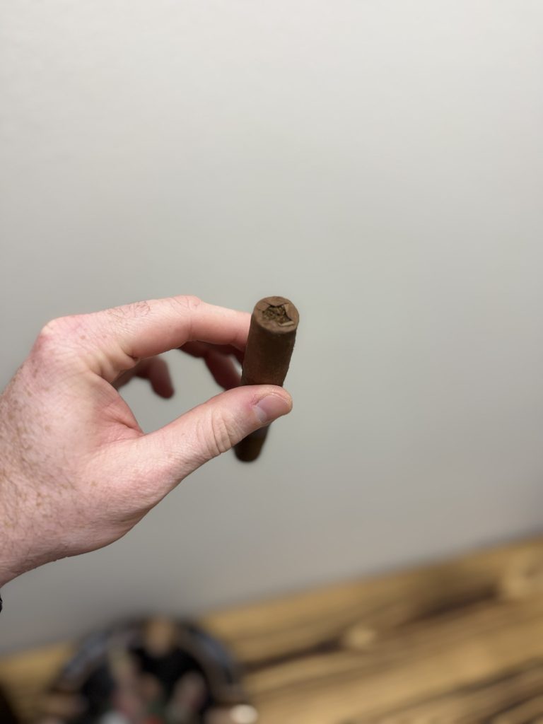 Closed foot of the Stolen Throne Call to Arms Sumatra Robusto before lighting.